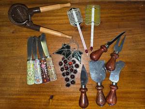 lot 34 image: Tons of Random Kitchen Items, Grape Decor, Thermometers, Cheese Knives, Juice Squeezer