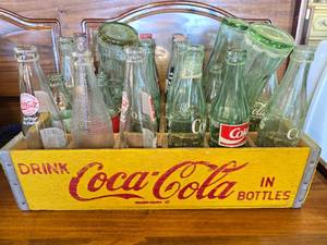 lot 31 image: Vintage Coke Bottles in a Coke Box