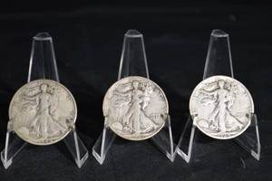 lot 30 image: Walking Liberty Half Dollar Trio - 3 Silver US Coins in Acrylic Stands