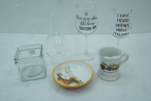 lot 274 image: Clear Glass Teardrop Hanging Terrarium, Wine Glasses, Vintage Porcelain Mustache Guard Mug Featuring a 191314 Morris Oxford Car