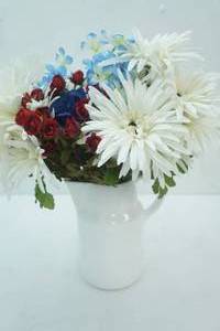 lot 466 image: Ceramic White Buttermilk Pitcher with Artificial Flower Arrangement-Red, White, & Blue