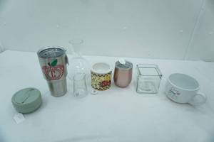 lot 474 image: Stainless Steel Coffee Mugs, Appetizer Cooling Dish, Clear Glass Vase, Clear Glass Candle Holder and more