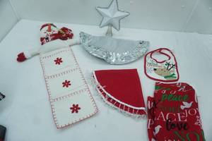 lot 526 image: Christmas Decor Lot tree skirts, star topper, table cloth, baby bib, snowman letter holder