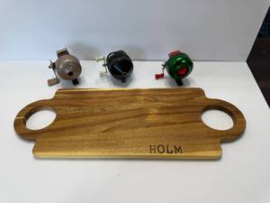 lot 13 image: CUTTING BOARD AND FISHING REELS