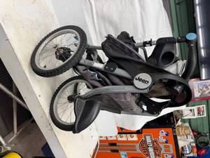 lot 48 image: THREE WHEELED STROLLER