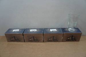 lot 21 image: Set of Four Lucky Shot Pint Glasses with Embedded Bullets