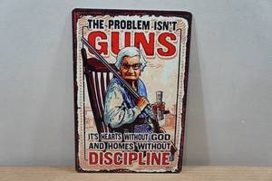 lot 85 image: Novelty Metal Sign - The Problem Isnt Guns
