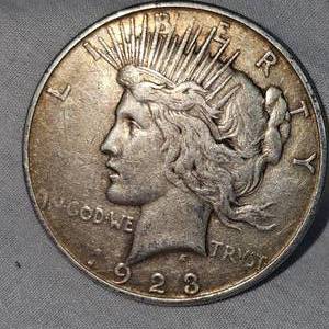 lot 5 image: 1923 S Peace Dollar $1 VG wToning