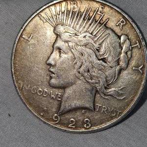1923 S Peace Dollar $1 VG w/Toning