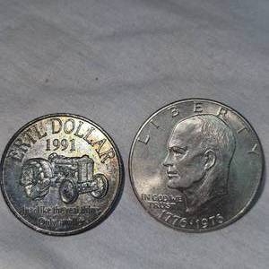 lot 12 image: 1991 Ertl Token Dollar and 1976 Ike Silver Dollar