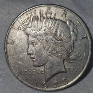 lot 28 image: 1923 O Peace Dollar $1 VG Plus