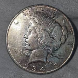lot 30 image: 1934 D Peace Dollar $1 in VG PluswToning