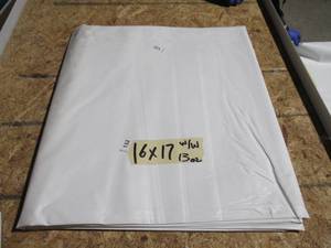 lot 132 image: NEW Vinyl Tarp - 16 x 17  White  White Vinyl tarp - 13 oz. Midweight Duty