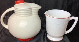 lot 36 image: Vintage Milk Glass Measuring Cup with Red Trim and Utility Ware  Pitcher by Knowles China Co.