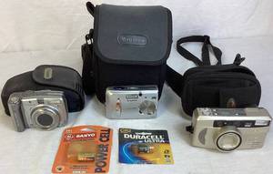 lot 84 image: Cannon, Nikon, Fuji Point and Shoot Camera Package