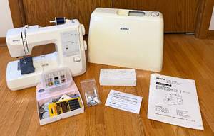 lot 88 image: Kenmore Sewing Machine Model 385.17324 with Assorted Supplies