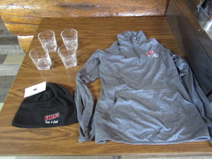 lot 142 image: Karens Bar & Grill Drink Glasses, Hat, Shirt