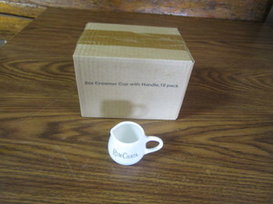 lot 141 image: (12) Rum Chata Creamer Cups