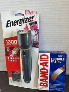 lot 76 image: 1300 Lumens Flashlight and Band-Aids