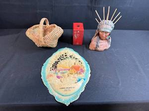 lot 67 image: Vintage Decor Lot with Red Metal Bank, Chief Bust, Woven Basket, and Farmers Creamery Plaque