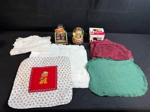 lot 80 image: Holiday Decor and Linens Lot with Snowman Block Calendar, Santa Snow Globe, Tree Topper, and Doilies