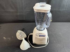 lot 94 image: Osterizer 10-Speed Blender with Strainer and Funnel Accessories