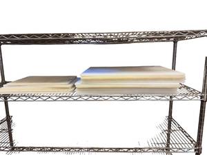 lot 262 image: Shelf of assorted cutting boards