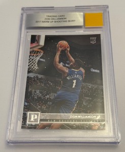 lot 51 image: Zion Williamson 2017 Warm Up Shooting Shirt RC Beckett 2019-20 Chronicles #120 Rookie Baketball Card