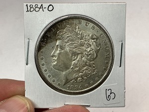 lot 63 image: 1884-O Morgan Silver Dollar