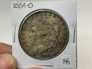 lot 145 image: 1884-O Morgan Silver Dollar
