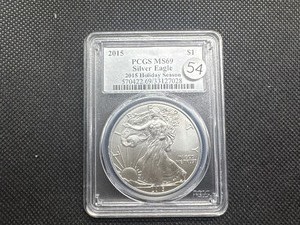 lot 54 image: 2015 1 Oz. Silver American Eagle PCGS MS69 - 2015 Holiday Season