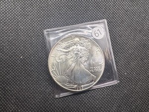 lot 61 image: KEY DATE 1986 1 Oz. American Silver Eagle - First Year of Issue