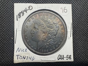 lot 16 image: 1884-O Morgan Silver Dollar Marked AU58 When Purchased - Nice Bronze Toning