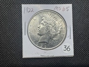 lot 36 image: 1922 Peace Silver Dollar Marked MS66 When Purchased - Great Detail and Nice Mint Luster