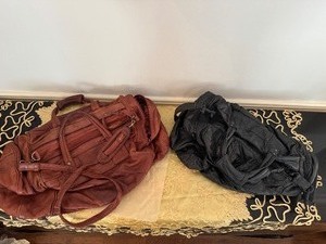 lot 67 image: Vintage Brown and Black Leather Duffel Bags