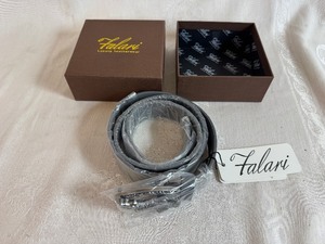 lot 106 image: Falari Luxury Leatherwear Gray Belt with Silver Toned Alligator Buckle (estimated size 3234)