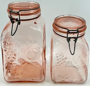 lot 29 image: Pink Depression Glass Jars with Grapes Embossed Pattern & Clamp-Lid Closures