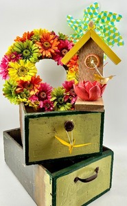 lot 59 image: Decorative Birdhouse & Floral Arrangement On Vintage Stack Of Drawers
