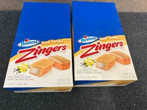 lot 158 image: 2 Packs Of Hostess Iced Vanilla Zingers