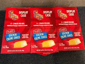 lot 167 image: 3 Display Cases Of Dolly Golden Cr�me Cakes