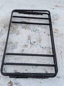 lot 13 image: 60 in by 33-in rack metal iron RV rack with bracket