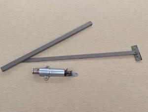 lot 20 image: 2 Styles of Door Hold Openers