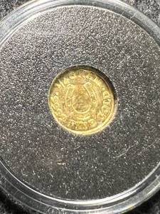 lot 34 image: 14TH GRAM .9999 FINE GOLD MONARCH METALS ROUND IN CASE