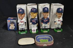 lot 55 image: Minnesota Twins Bobblehead Set (4) & Mini-Mauer Box & Treasure Island Stadium Tin