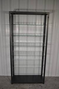 lot 82 image: Glass Display Cabinet 36W x 14.25D x 74.25H - Black Metal Frame, 7 Glass Shelves