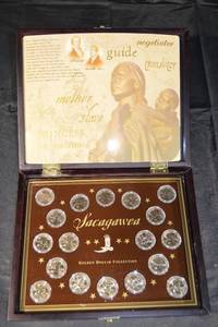 lot 132 image: Sacagawea Dollar Collection - Golden Dollar Display Case with Coins