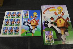 lot 260 image: USPS Sylvester & Tweety Commemorative Stamp Poster with Matching Stamp Sheet Set