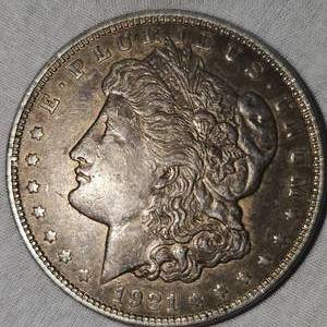 lot 22 image: 1921 Morgan Dollar $1  F wToning