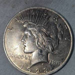 lot 34 image: 1923 Peace Dollar $1  XF wGold Patina