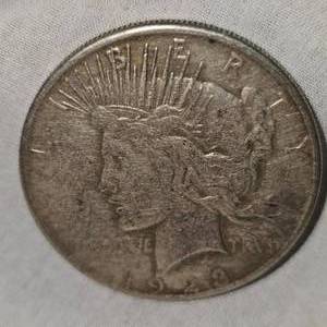 lot 9 image: 1923 S Peace Dollar $1 XF with Patina